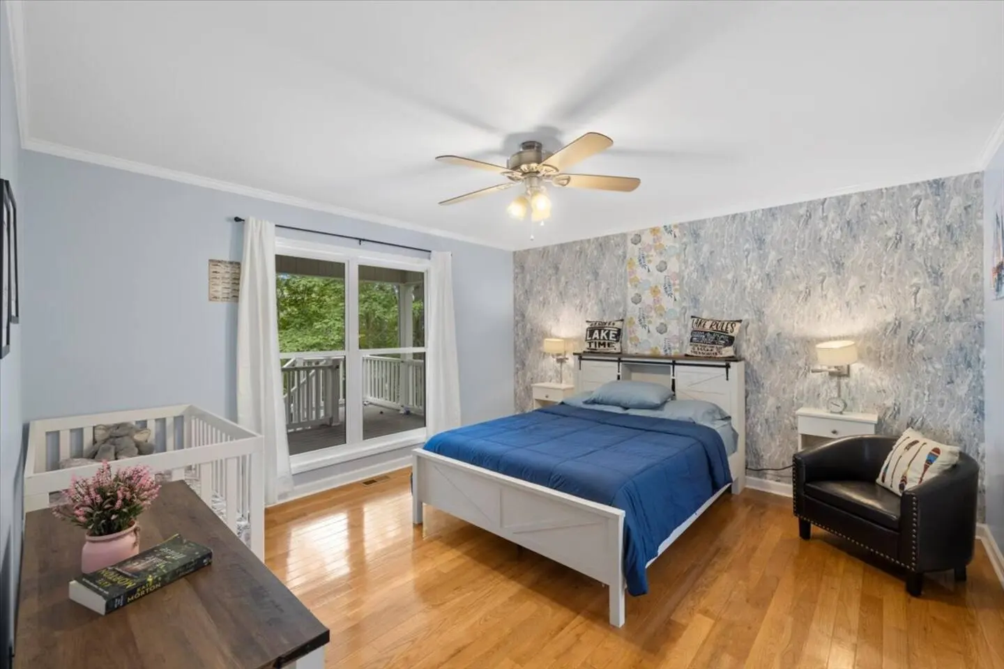 Bedroom with a queen bed and lake views through the windows